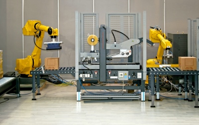 Package handling robots on an automated factory line.